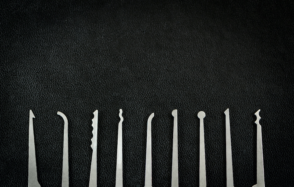 Lock Picking Copy Space Background - Tools Isolated on Black